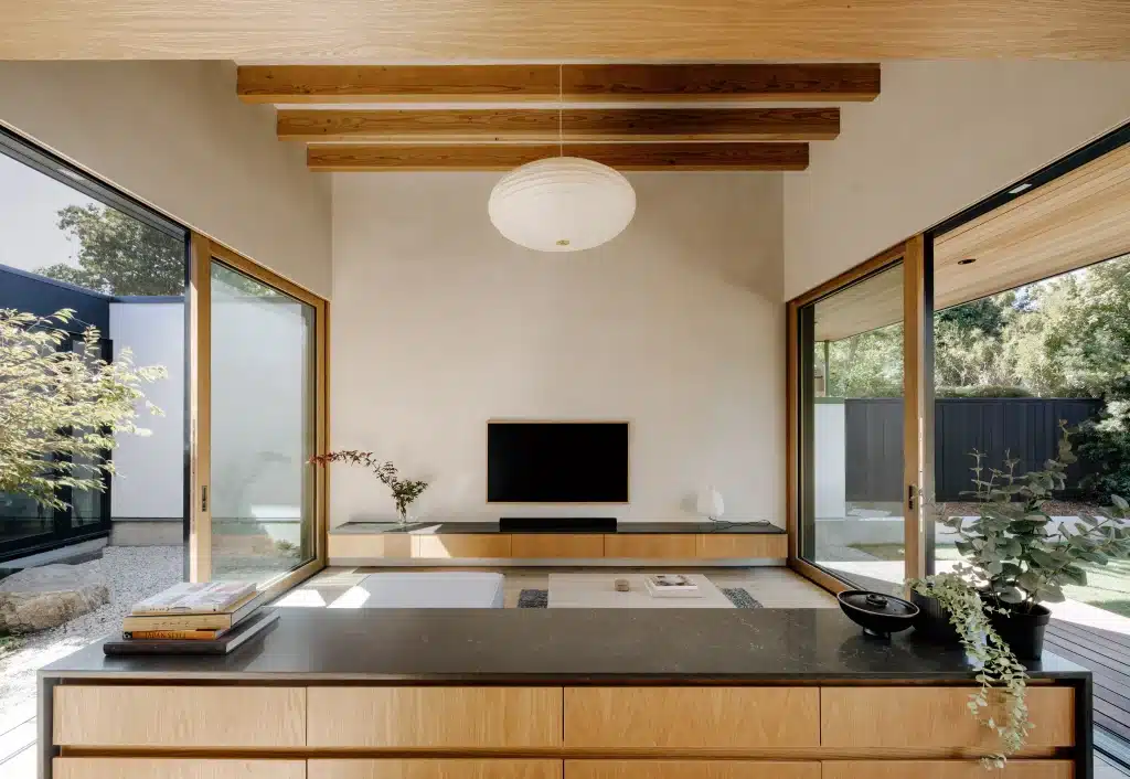 Living room with TV wall, home remodel by Art of Construction